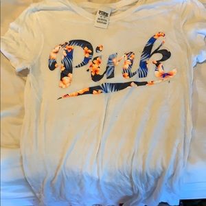 A Victoria’s Secret pink t shirt.